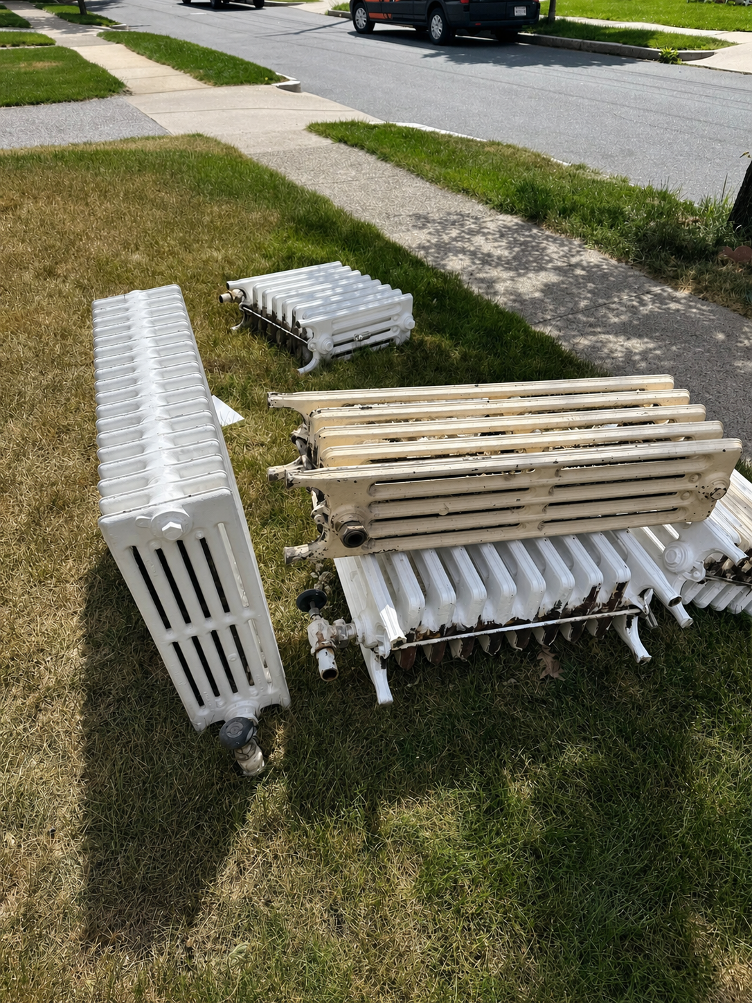 Cast iron radiators removed from Melrose home during HVAC renovation