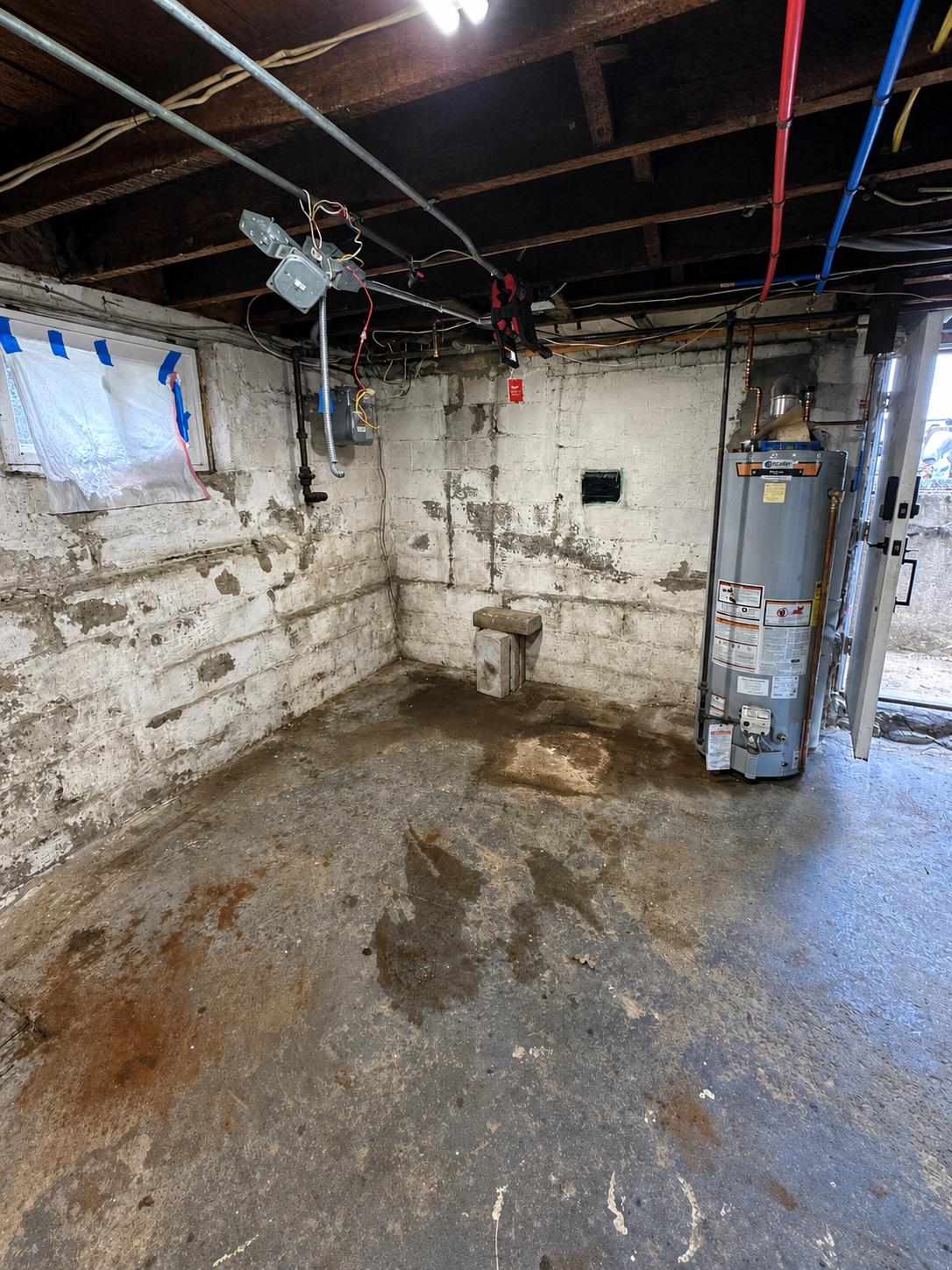 Mechanical room cleared after old boiler removal in Melrose Massachusetts