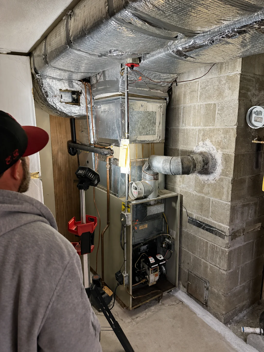 Existing heating system and ductwork before a Stoneham HVAC replacement