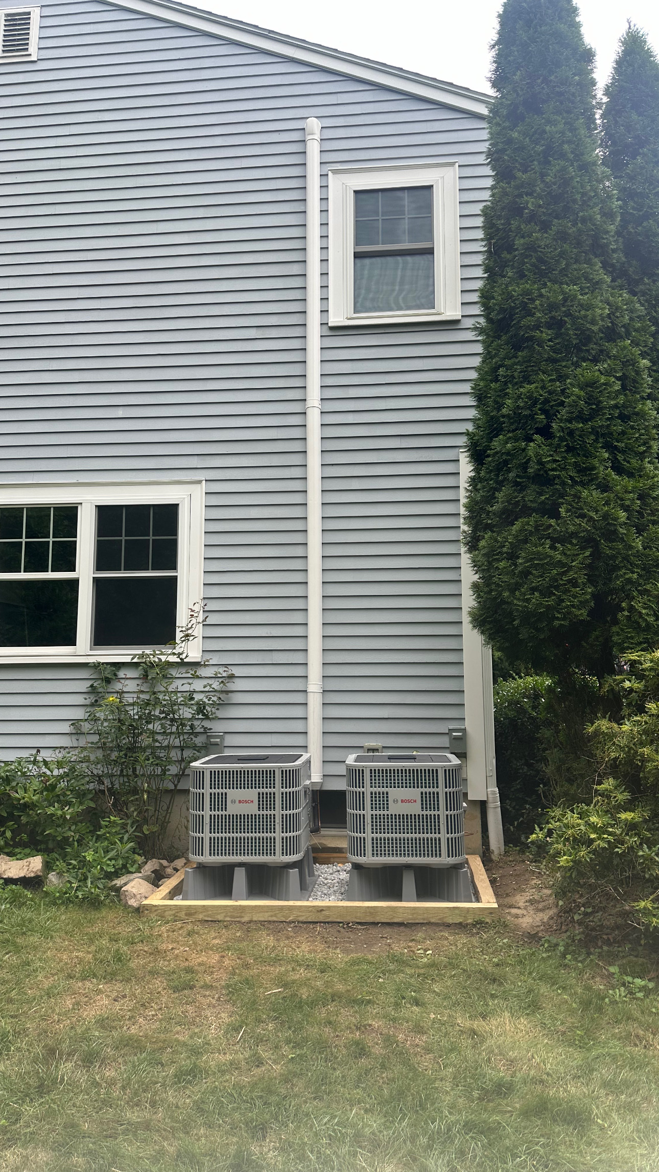 Two Bosch central air conditioning condensers installed by EML Mechanical