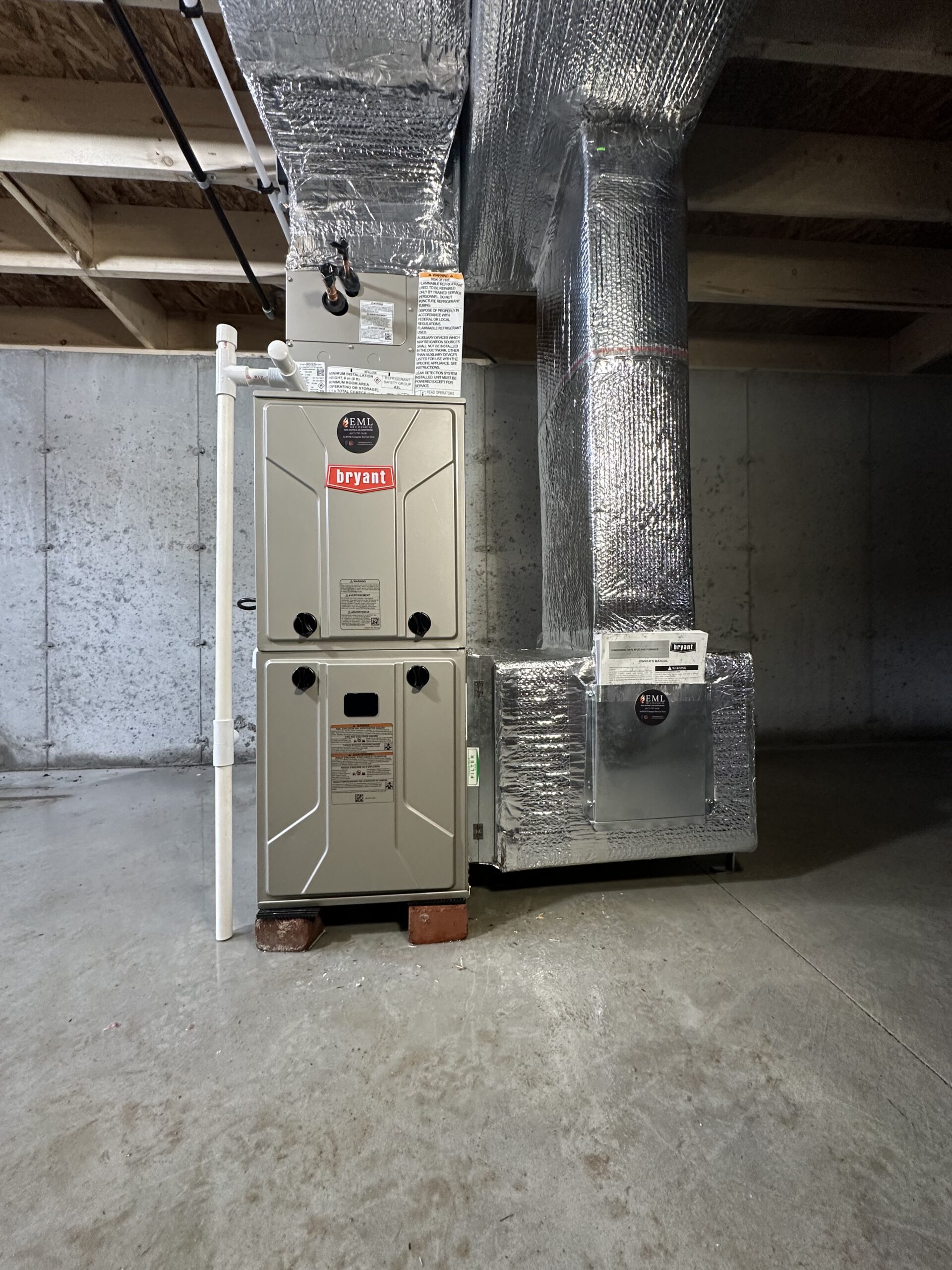 Bryant furnace connected to custom insulated ductwork installed by EML Mechanical
