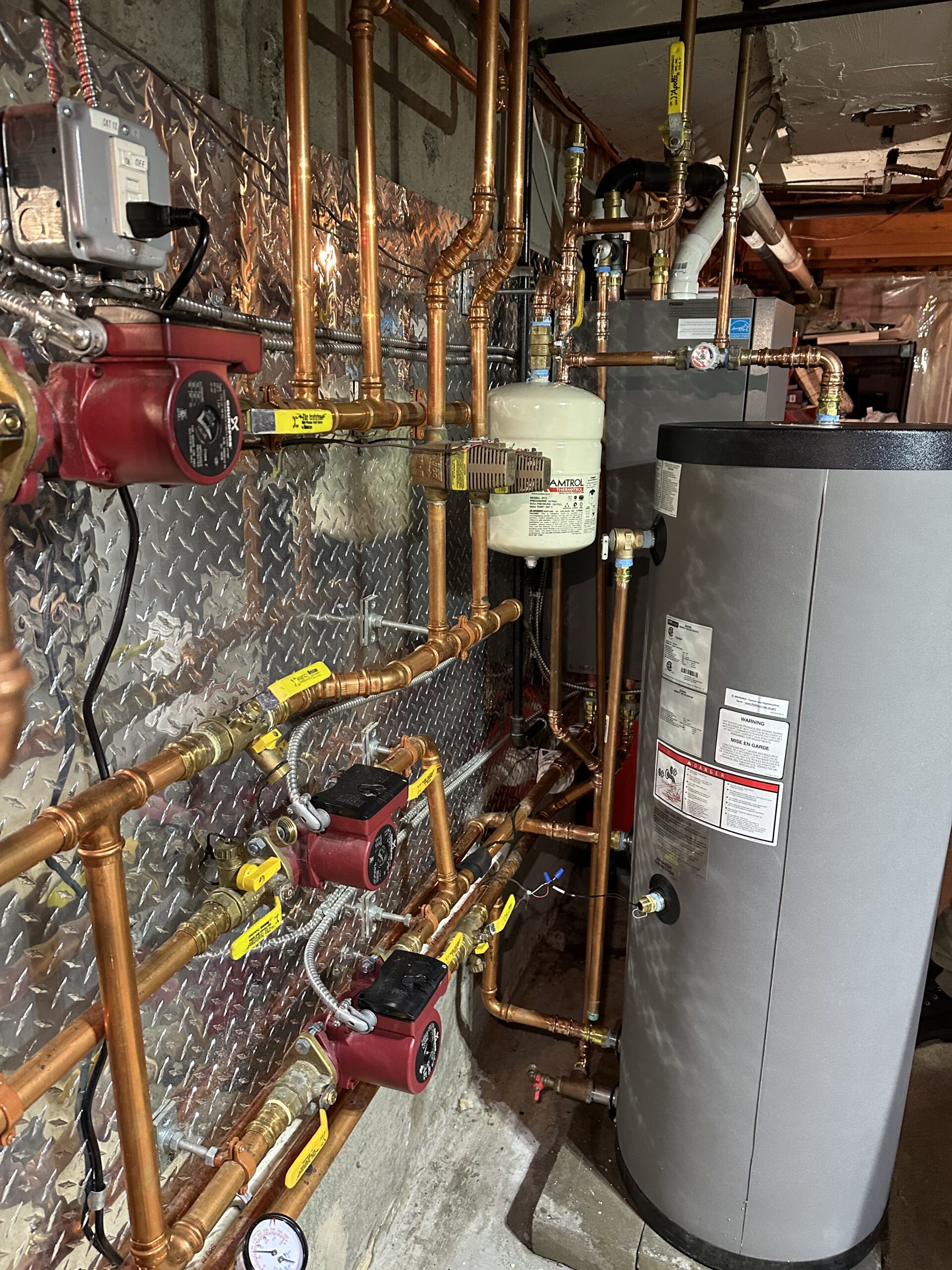 Hydronic boiler piping and indirect water heater installed by EML Mechanical