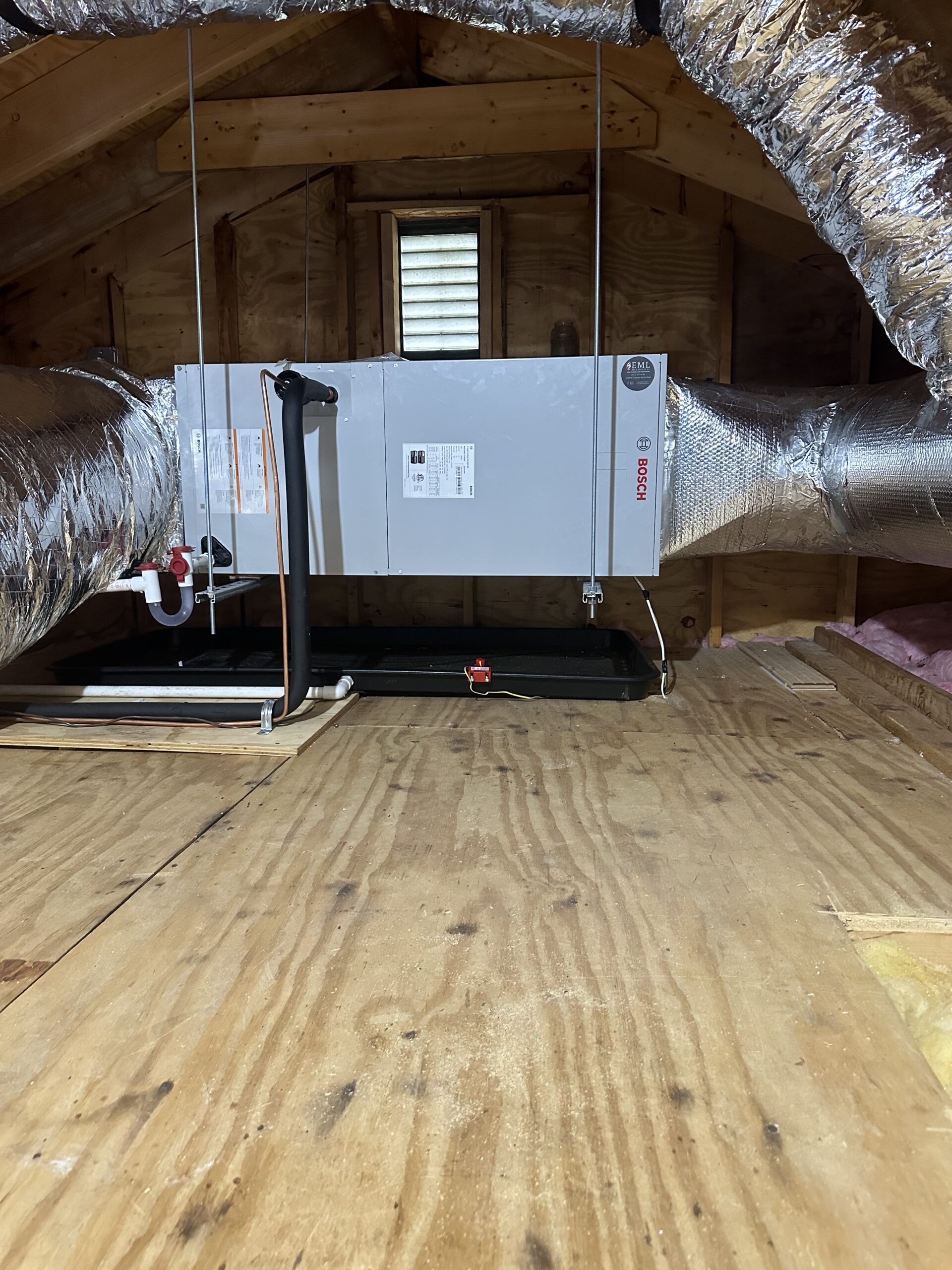 Central air handler installed in an attic by EML Mechanical